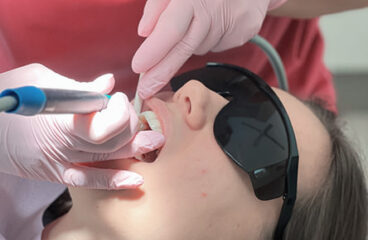 Patient receiving dental care at Modern Smile Design in Sarasota. Patient receiving dental care at Modern Smile Design in Sarasota.