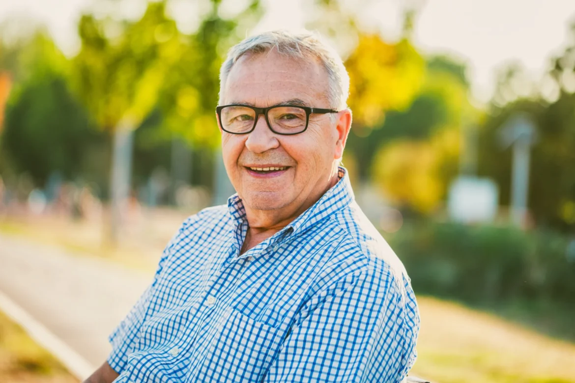 Outdoor portrait of happy senior man.