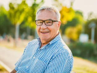 Outdoor portrait of happy senior man.