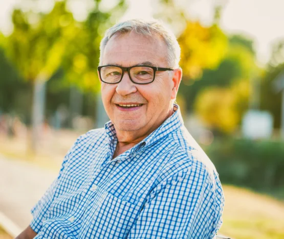 Outdoor portrait of happy senior man.