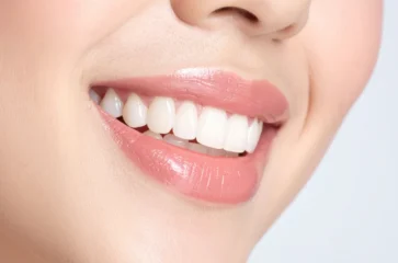 cosmetic-dentistry-card Woman smiling showing cosmetic dentistry work