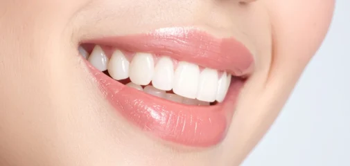 Woman smiling showing cosmetic dentistry work
